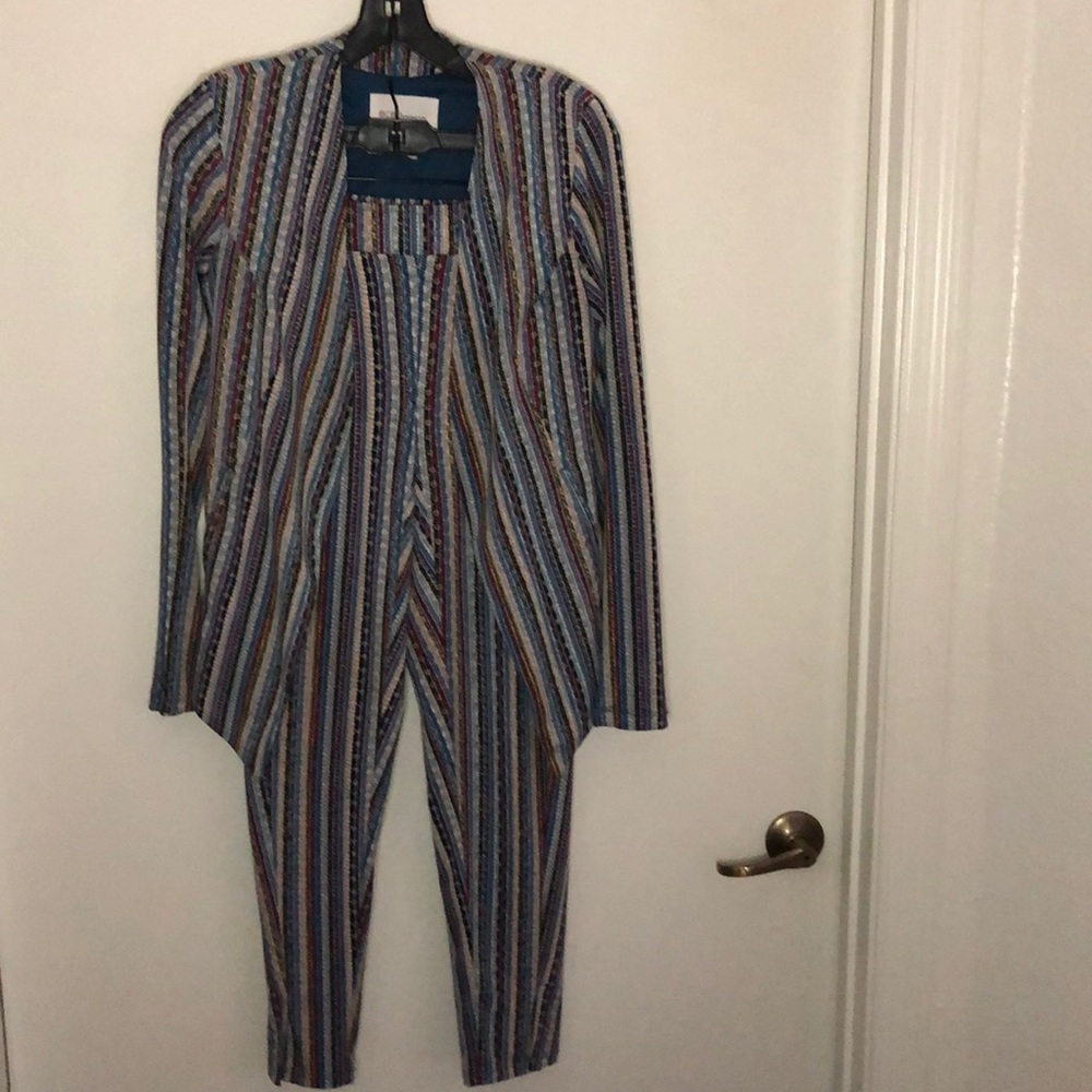 Includes.  Blazer and Pant set